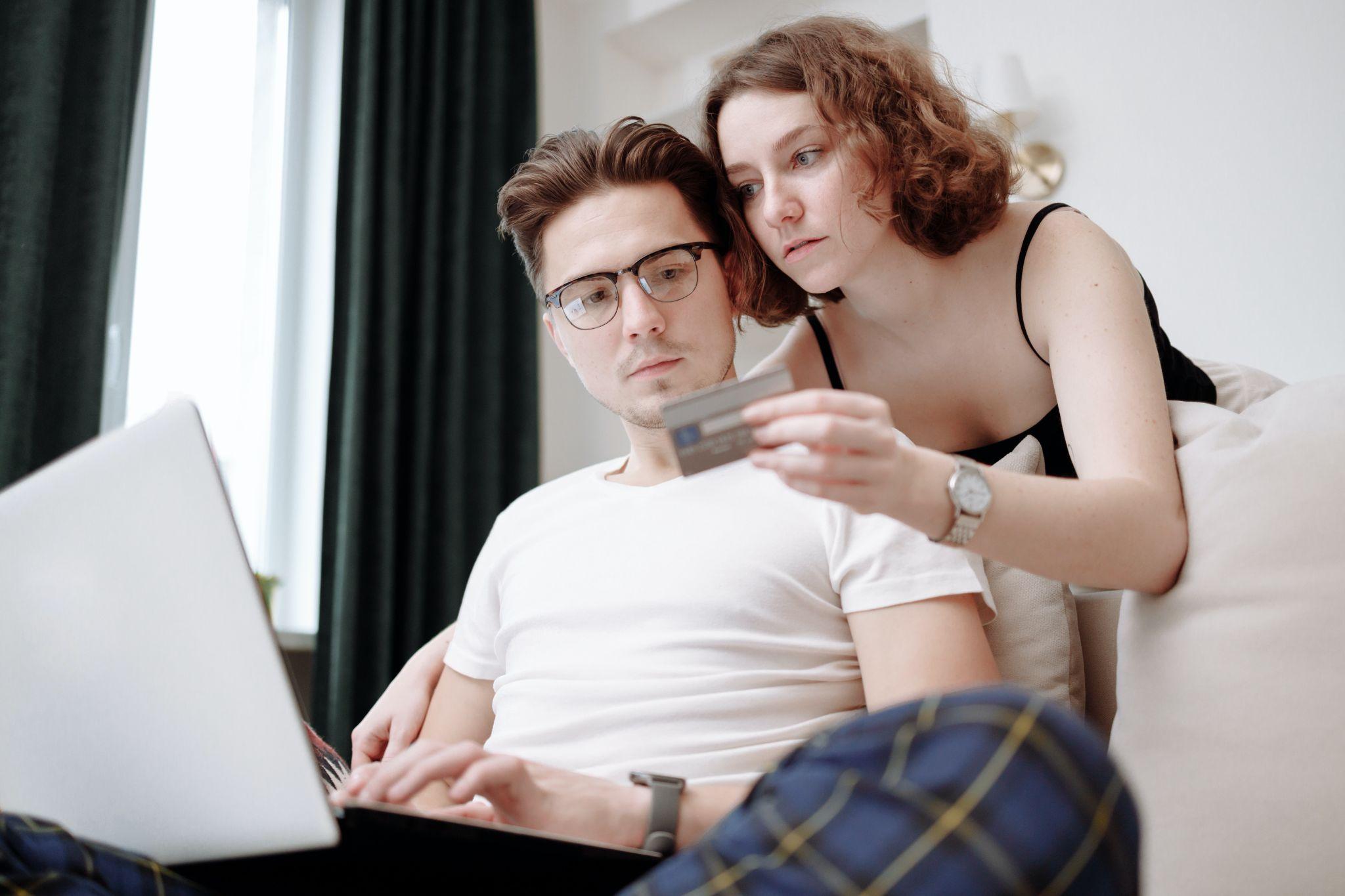 Couple Looking Credit Card Interest Rate